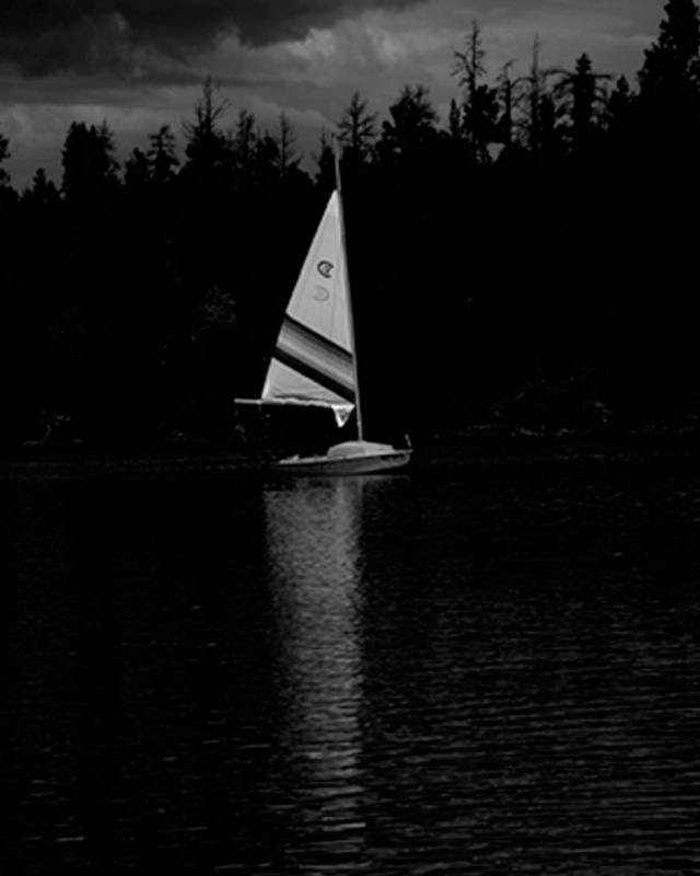 B/W photo of a boat on a lake